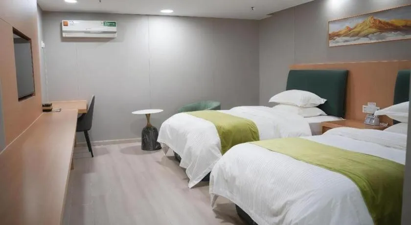 Bed in GreenTree Inn Taicang Baolong Square Hotel