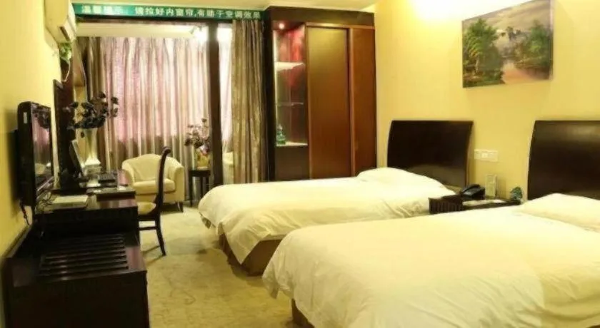 Bed in GreenTree Inn Taicang Baolong Square Hotel
