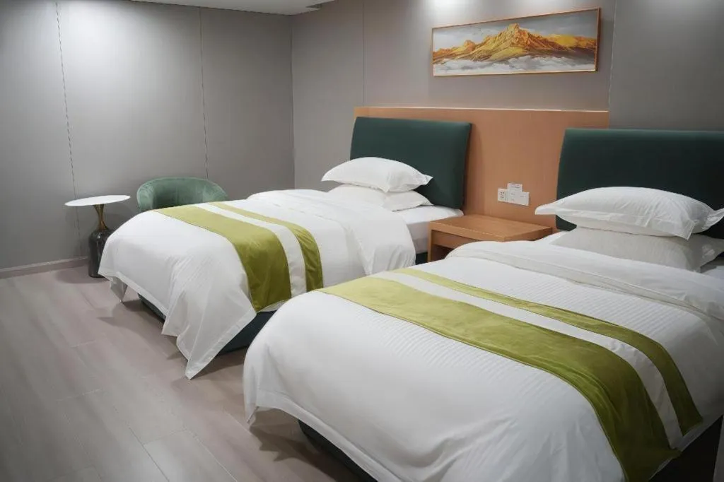 Bed in GreenTree Inn Taicang Baolong Square Hotel