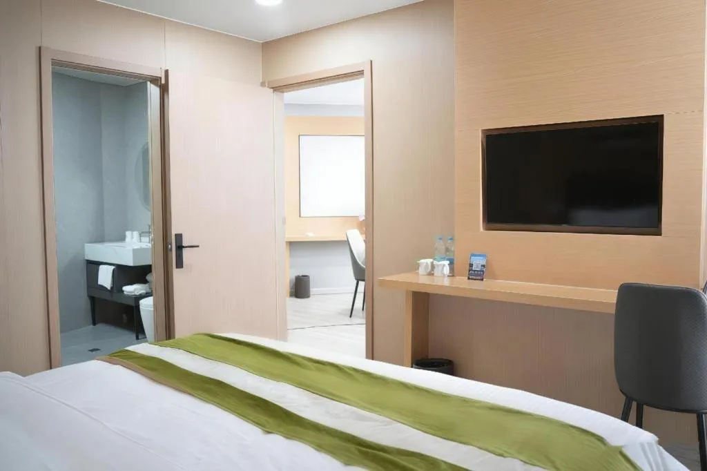 Bed in GreenTree Inn Taicang Baolong Square Hotel