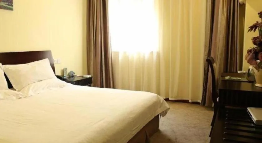 Bed in GreenTree Inn Taicang Baolong Square Hotel