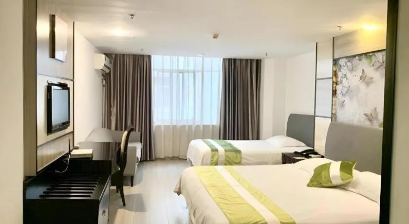 Bed in GreenTree Inn Taicang Baolong Square Hotel