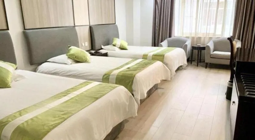 Bed in GreenTree Inn Taicang Baolong Square Hotel