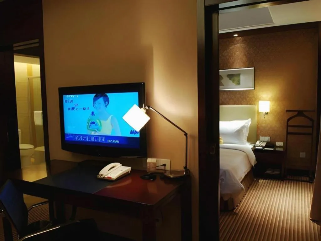 Bed in Yiwu Shinsun International Hotel