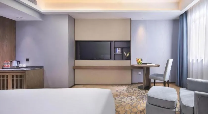 Bed in Vienna Hotel Guangxi Guilin 7-Star Wanda Plaza