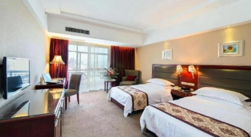 Bed in Vienna Hotel Guangxi Guilin 7-Star Wanda Plaza