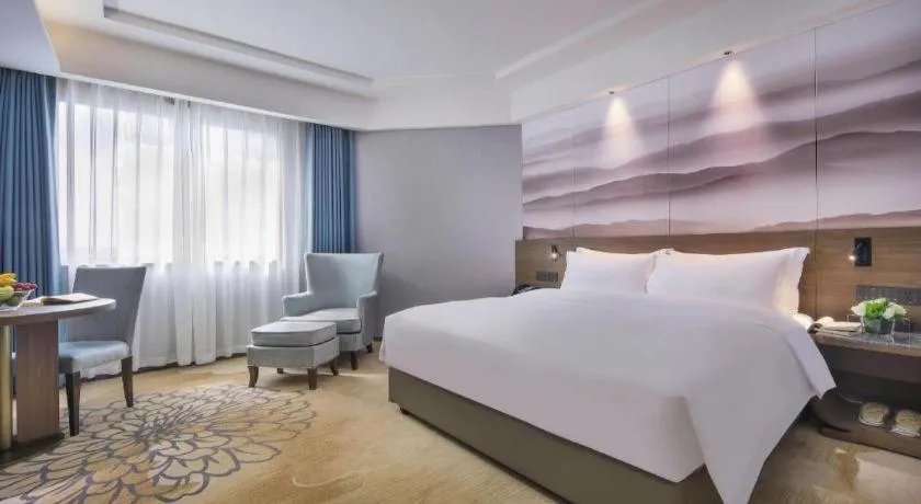 Bed in Vienna Hotel Guangxi Guilin 7-Star Wanda Plaza