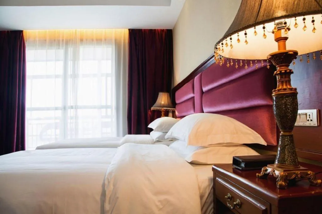 Bed in Vienna Hotel Guangxi Guilin 7-Star Wanda Plaza