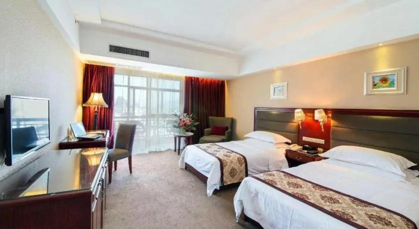 Bed in Vienna Hotel Guangxi Guilin 7-Star Wanda Plaza
