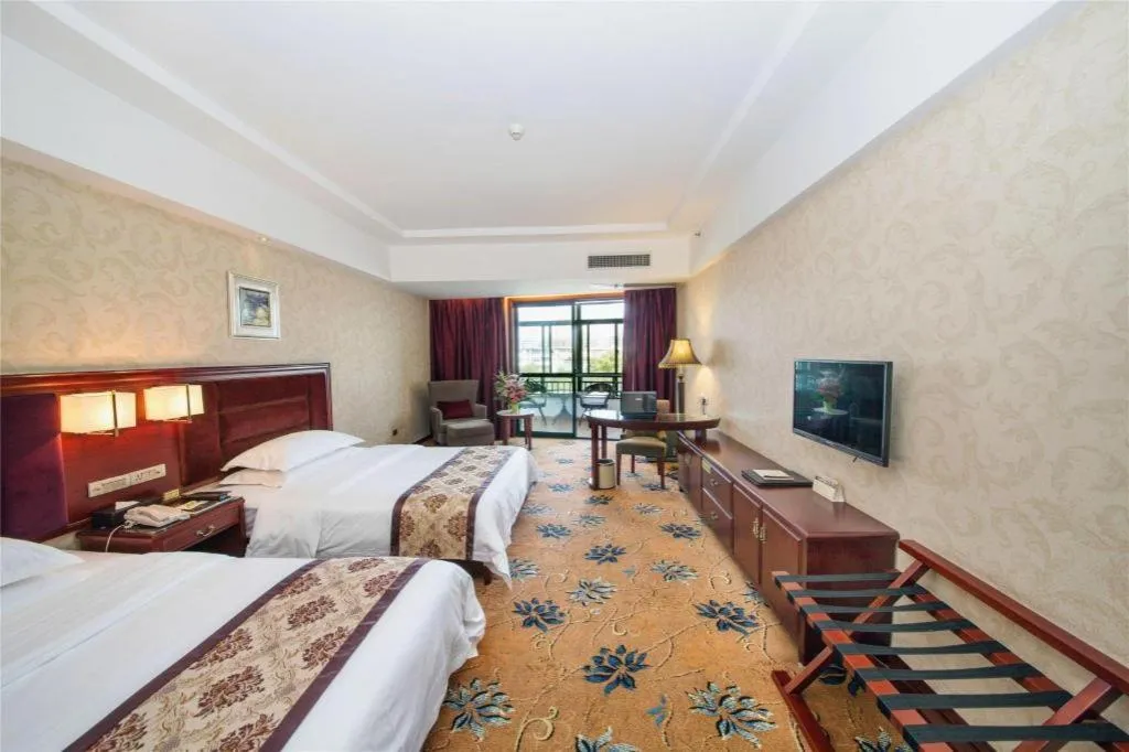 Bed in Vienna Hotel Guangxi Guilin 7-Star Wanda Plaza