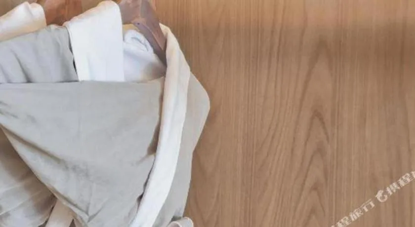 Bed in Vienna Hotel Guangxi Guilin 7-Star Wanda Plaza