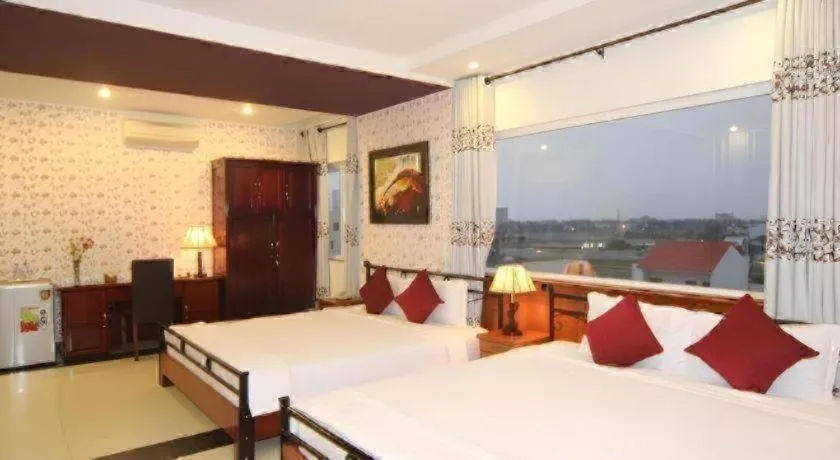 Bed in Omega Da Nang Beach Hotel