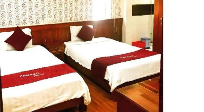 Bed in Omega Da Nang Beach Hotel