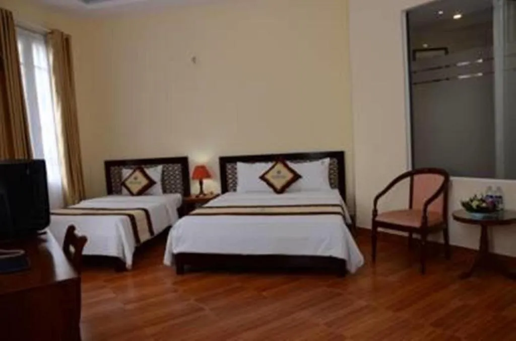 Bed in Omega Da Nang Beach Hotel