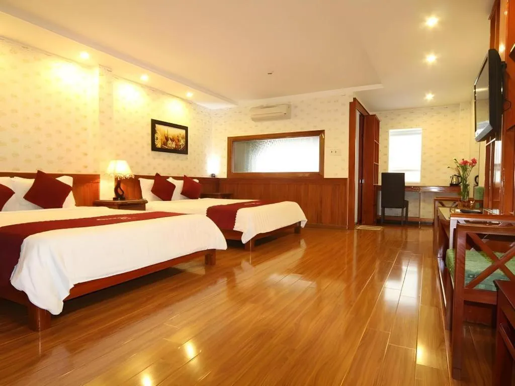 Bed in Omega Da Nang Beach Hotel