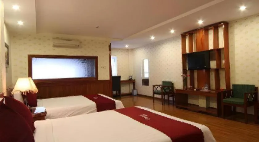 Bed in Omega Da Nang Beach Hotel
