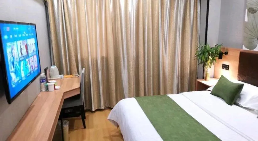 Bed in GreenTree Inn Yixing Zhangzhu Express Hotel