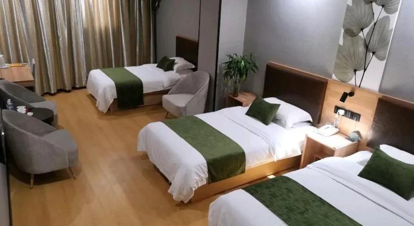 Bed in GreenTree Inn Yixing Zhangzhu Express Hotel