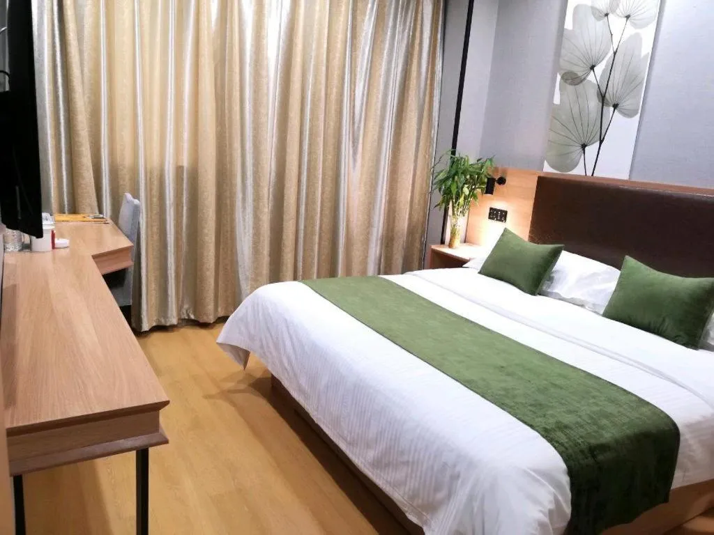 Bed in GreenTree Inn Yixing Zhangzhu Express Hotel
