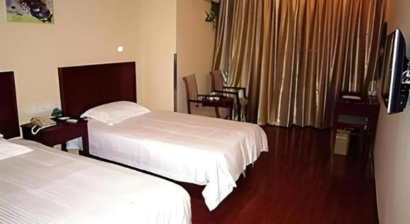 Bed in GreenTree Inn Yixing Zhangzhu Express Hotel