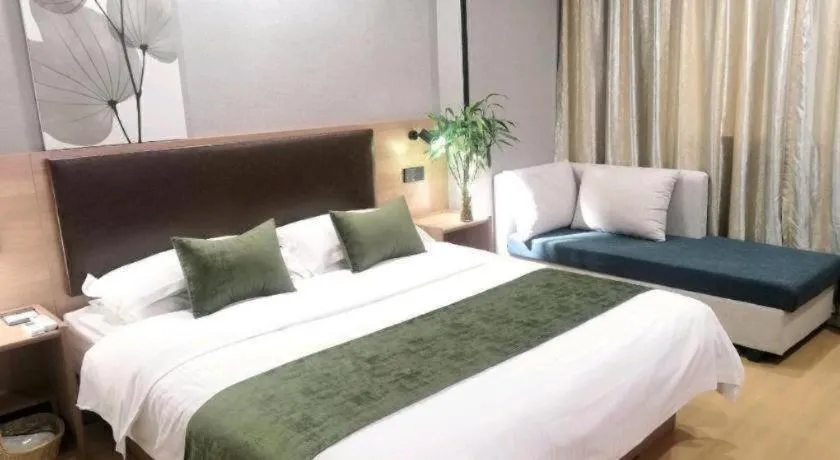 Bed in GreenTree Inn Yixing Zhangzhu Express Hotel