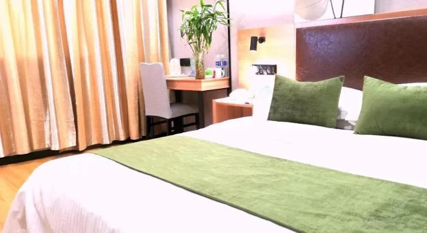 Bed in GreenTree Inn Yixing Zhangzhu Express Hotel