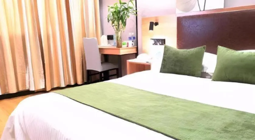 Bed in GreenTree Inn Yixing Zhangzhu Express Hotel