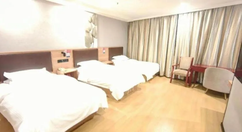 Bed in GreenTree Inn Yixing Zhangzhu Express Hotel
