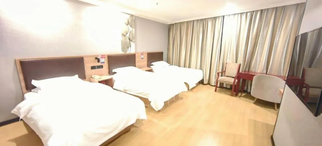 Bed in GreenTree Inn Yixing Zhangzhu Express Hotel
