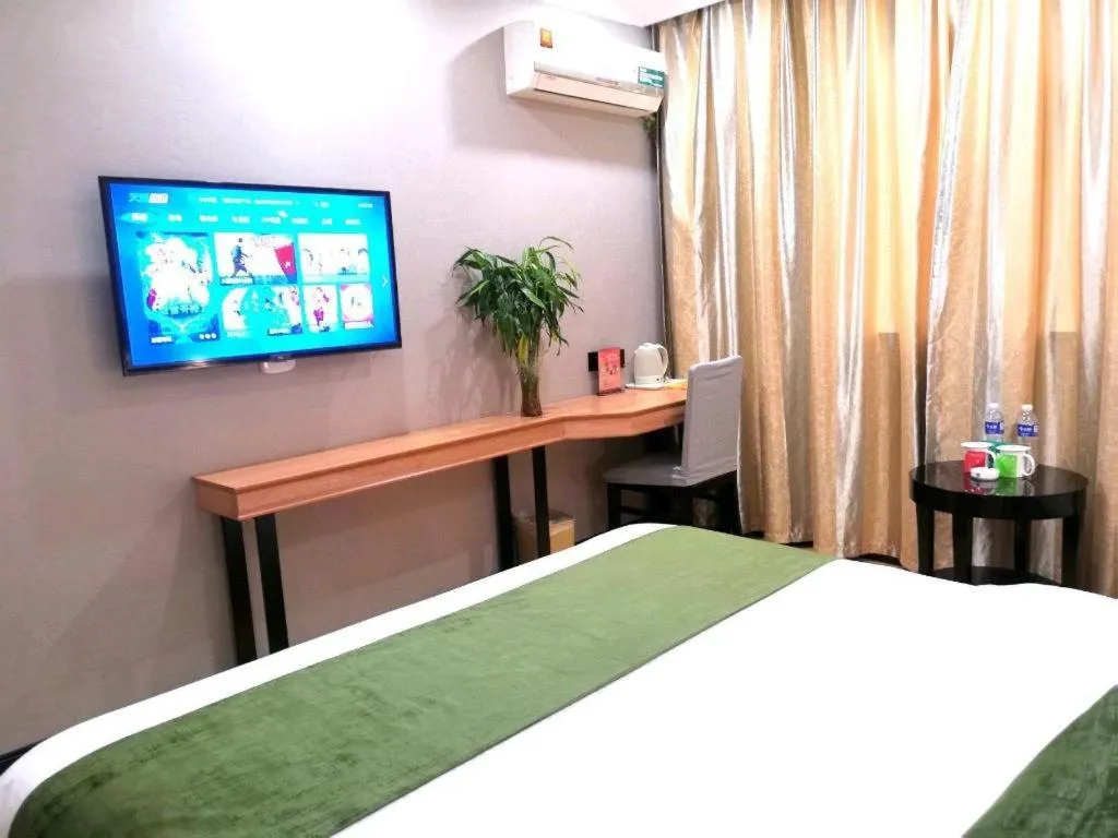 Bed in GreenTree Inn Yixing Zhangzhu Express Hotel