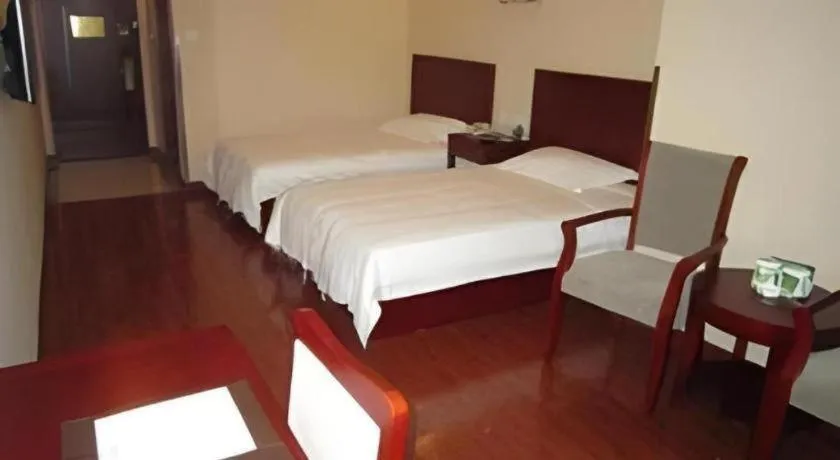 Bed in GreenTree Inn Yixing Zhangzhu Express Hotel