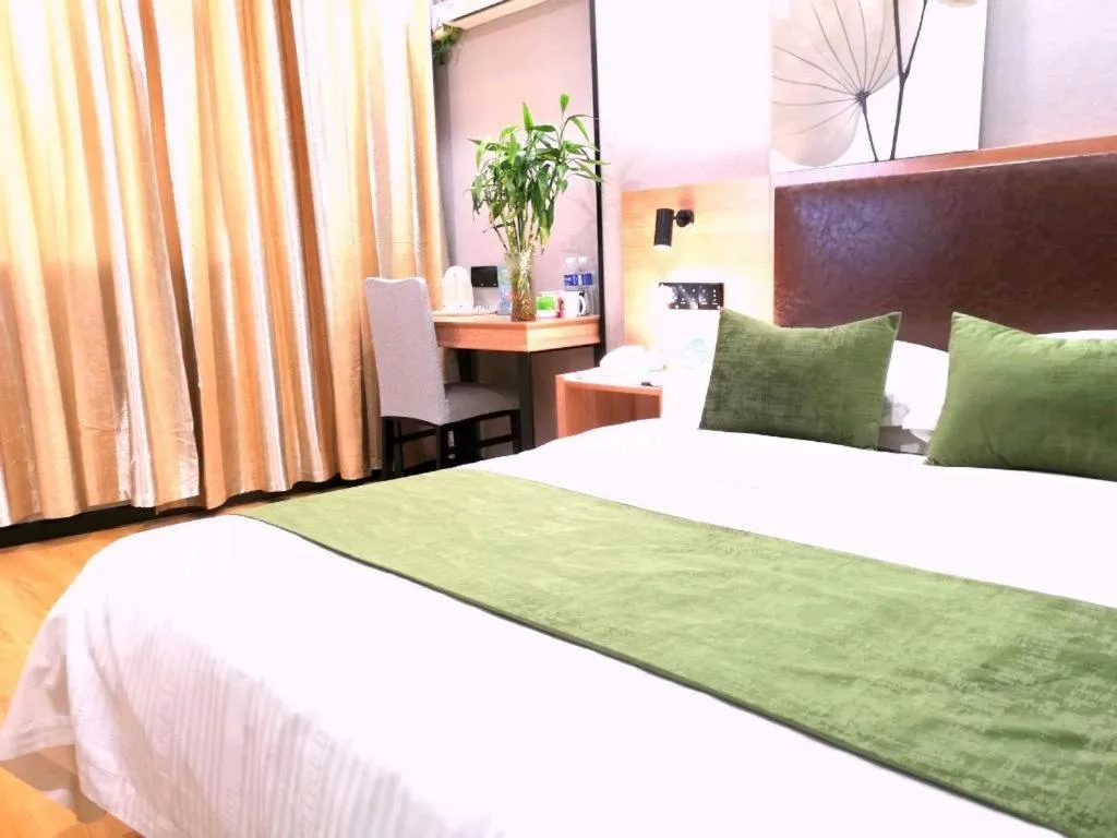Bed in GreenTree Inn Yixing Zhangzhu Express Hotel