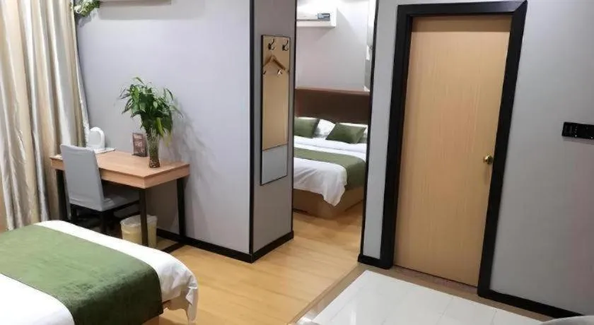 Bed in GreenTree Inn Yixing Zhangzhu Express Hotel