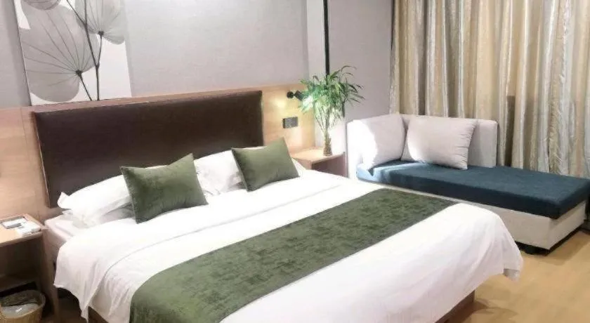 Bed in GreenTree Inn Yixing Zhangzhu Express Hotel