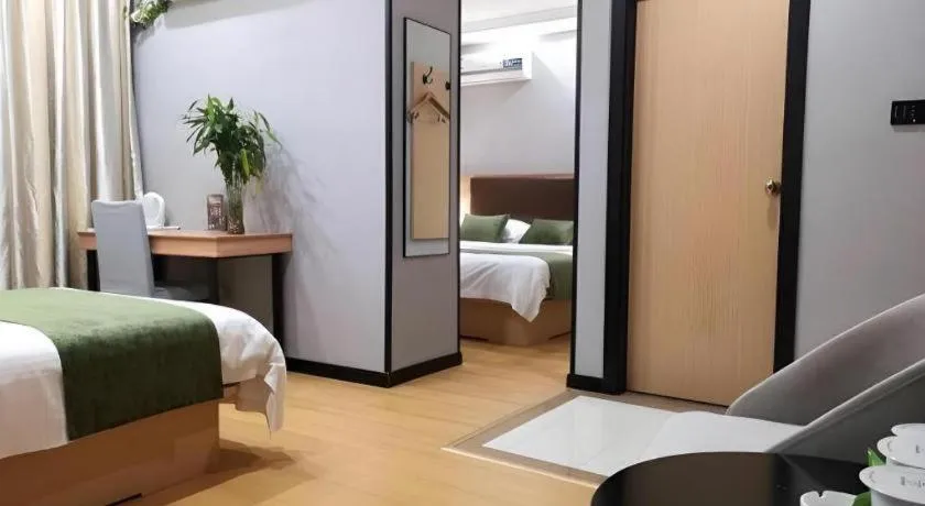 Bed in GreenTree Inn Yixing Zhangzhu Express Hotel