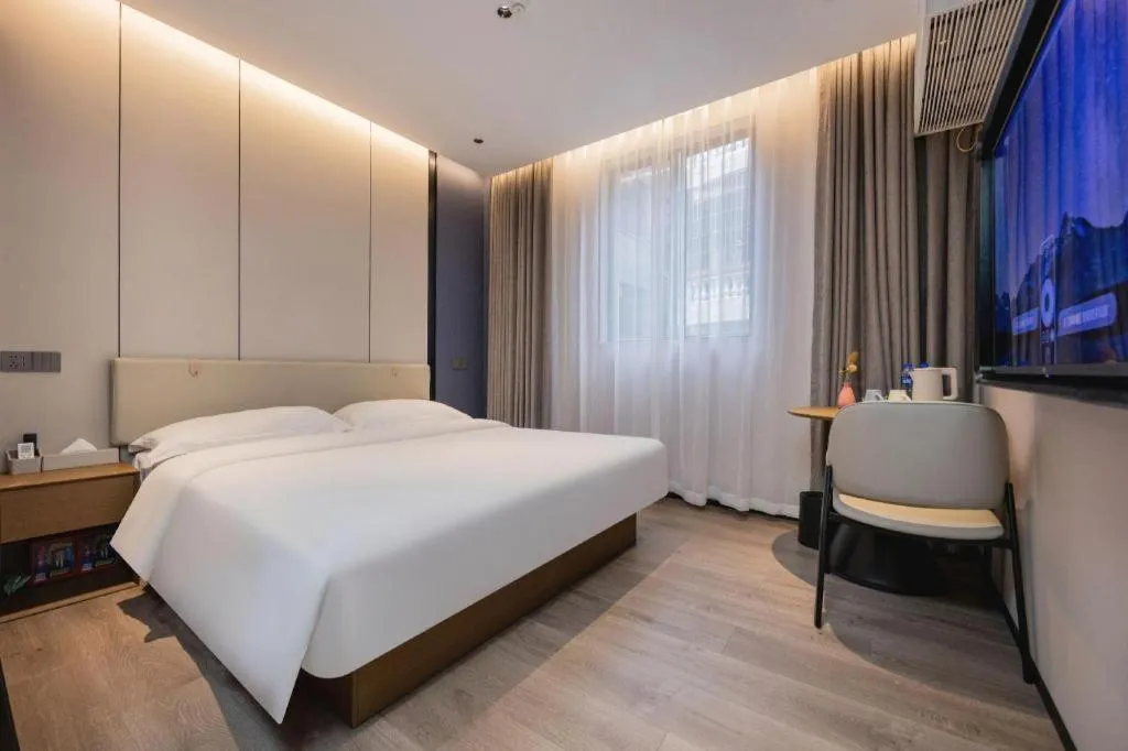 Bed in GreenTree Inn Guangzhou Panyu Bus Station Business Hotel