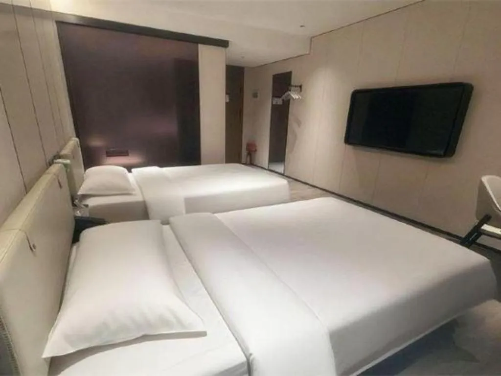 Bed in GreenTree Inn Guangzhou Panyu Bus Station Business Hotel