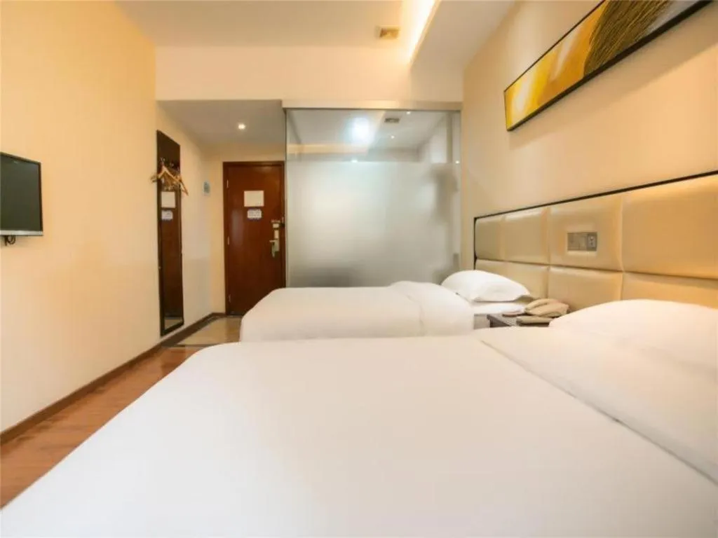 Bed in GreenTree Inn Guangzhou Panyu Bus Station Business Hotel