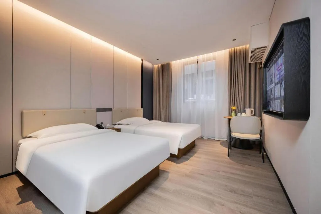 Bed in GreenTree Inn Guangzhou Panyu Bus Station Business Hotel