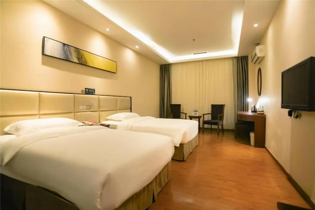 Bed in GreenTree Inn Guangzhou Panyu Bus Station Business Hotel