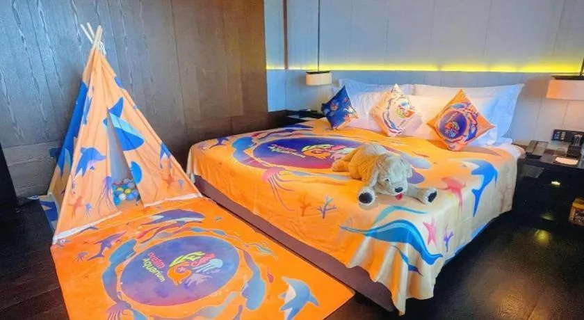 Bed in OCT Bay Breeze Hotel