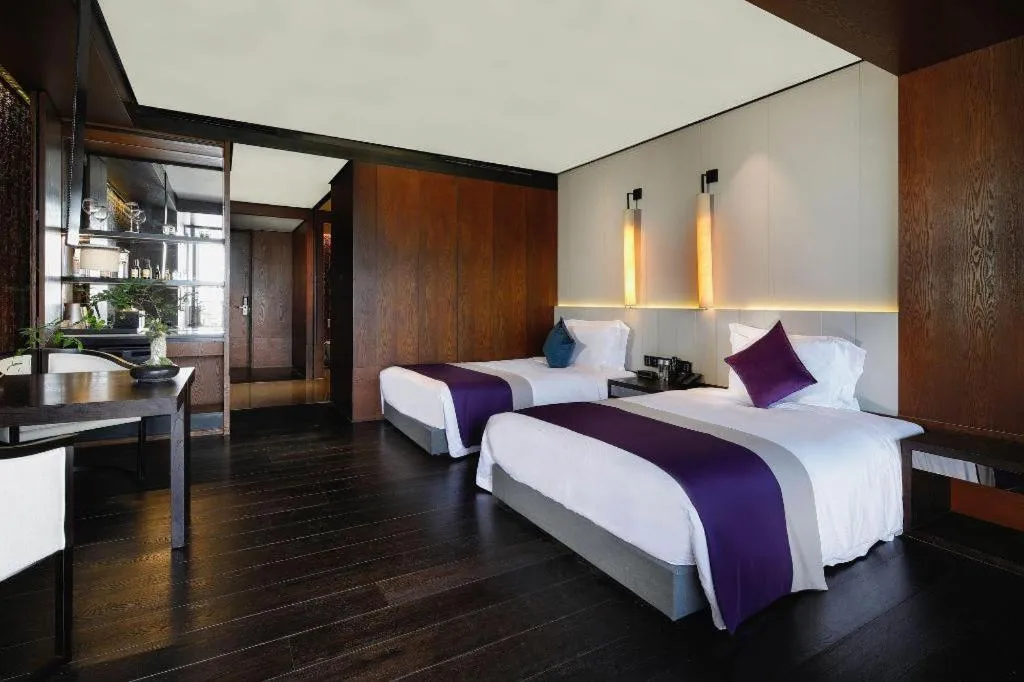 Bed in OCT Bay Breeze Hotel