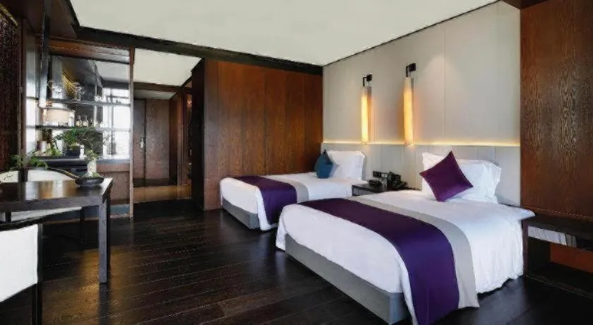 Bed in OCT Bay Breeze Hotel