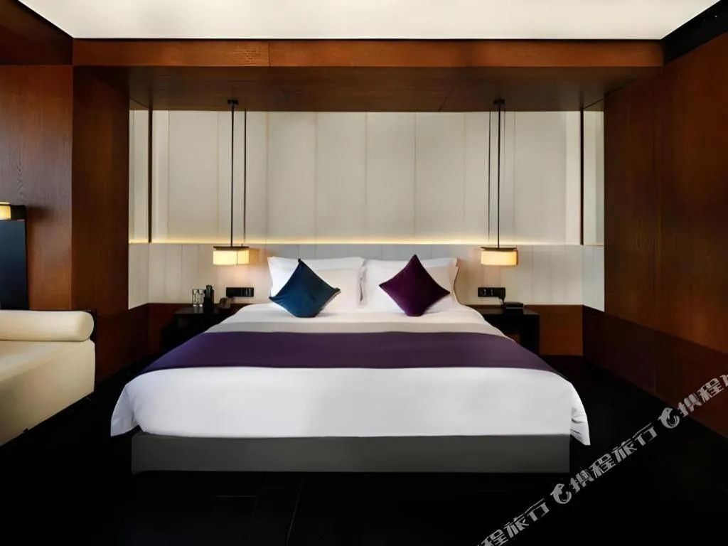 Bed in OCT Bay Breeze Hotel