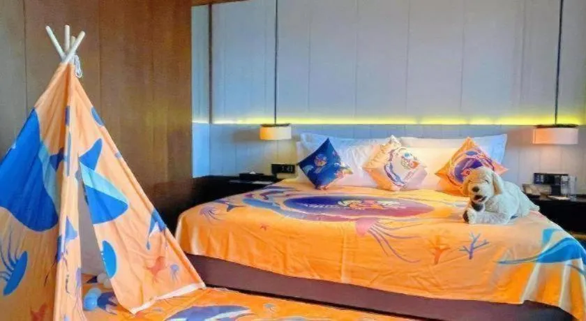 Bed in OCT Bay Breeze Hotel