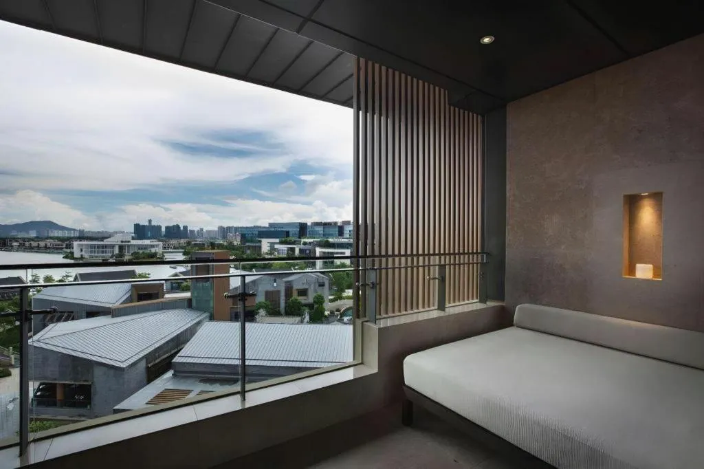 Bed in OCT Bay Breeze Hotel