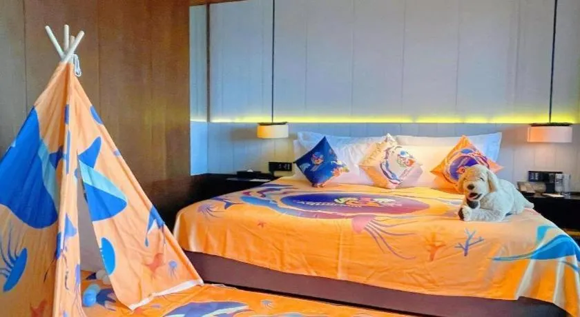 Bed in OCT Bay Breeze Hotel