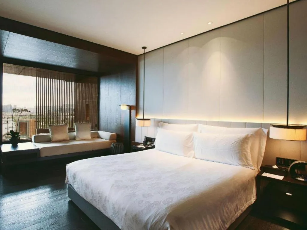 Bed in OCT Bay Breeze Hotel