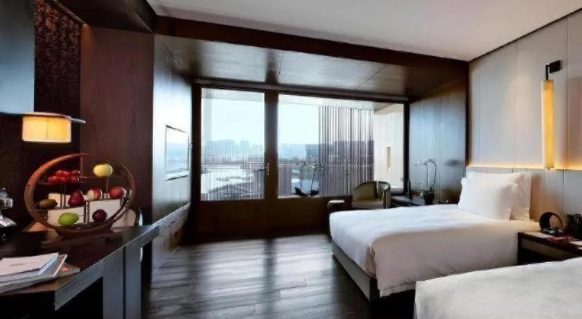 Bed in OCT Bay Breeze Hotel