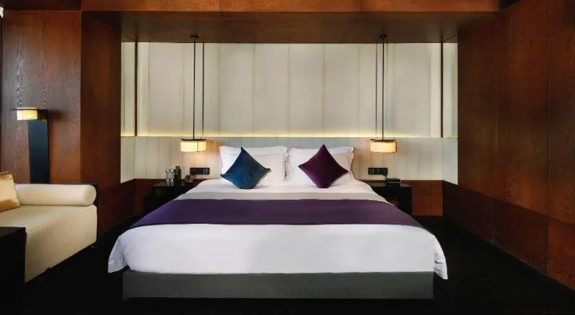 Bed in OCT Bay Breeze Hotel